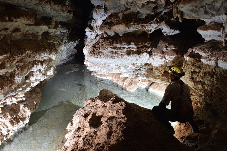 Caver by Lake in Wind Cave low res 768x511